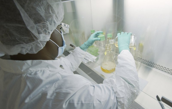In this May 2020 photo provided by Eli Lilly, a researcher tests possible COVID-19 antibodies in a laboratory in Indianapolis.