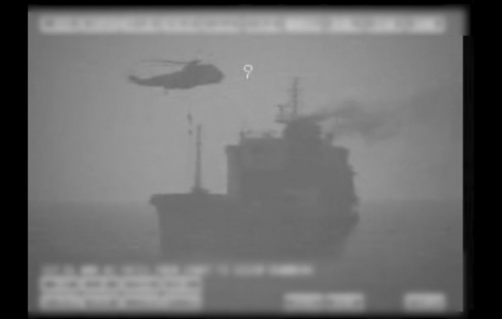 In this image made from video released by the U.S. military's Central Command, Iranian commandos fast-rope down from a helicopter onto the MV Wila oil tanker in the Gulf of Oman off the coast