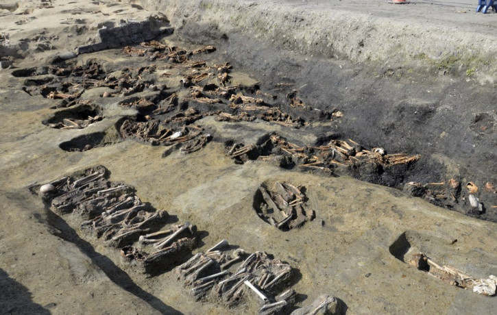 This undated photo provided Wednesday, Aug. 26, 2020, by Osaka City Cultural Properties Association shows human bones found at the north section of the "Umeda Grave" burial site in Osaka, wes