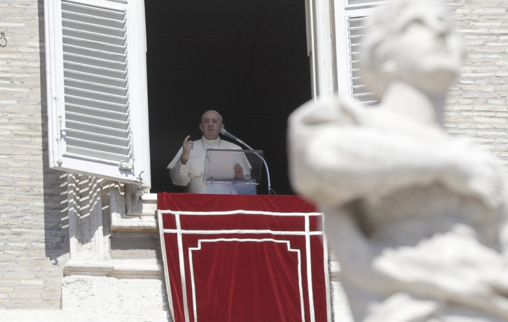Pope Francis recites the Angelus noon prayer from his studio window overlooking St. Peter's Square, at the Vatican, Sunday, Sept. 6, 2020.