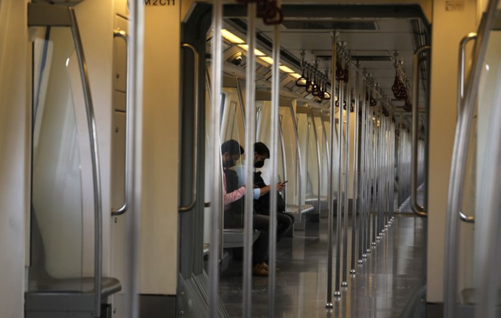 Commuters travel in an almost empty Delhi metro train in New Delhi, India, Monday, Sept. 7, 2020.