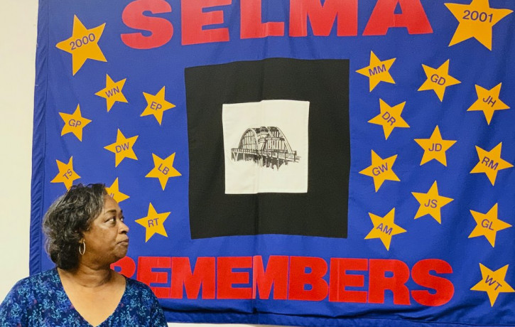 Mel Prince, executive director of Selma AIR, looks at a quilt that remembers people who lost their lives to AIDS, at her office in Selma, Ala., on Sept 3, 2020.