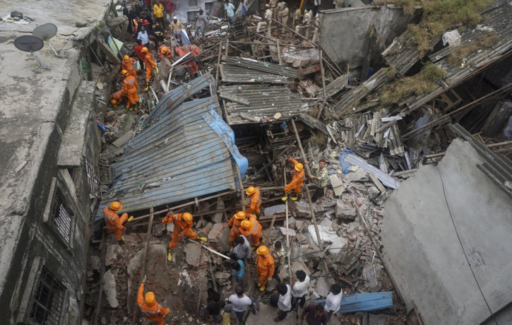 Rescuers look for survivors after a residential building collapsed in Bhiwandi in Thane district, a suburb of Mumbai, India, Monday, Sept.21, 2020.