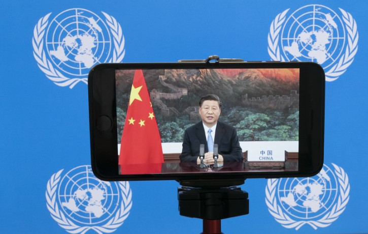 Chinese President Xi Jinping is seen on a video screen remotely addressing the 75th session of the United Nations General Assembly, Tuesday, Sept. 22, 2020, at U.N. headquarters.