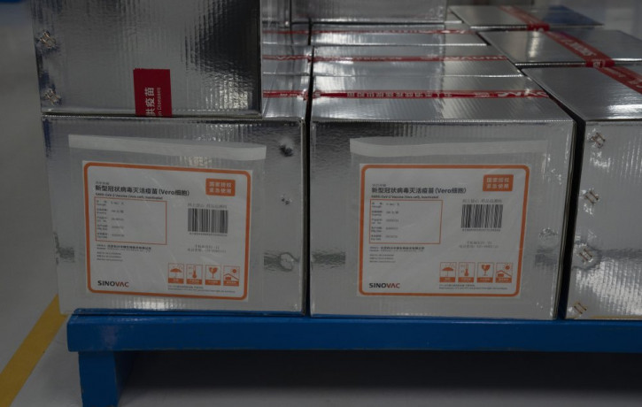 Boxes of SARS CoV-2 Vaccine for COVID-19 stamped with the words "State Authorized, Emergency Use" produced by SinoVac are stacked at its factory in Beijing on Thursday, Sept. 24, 2020.