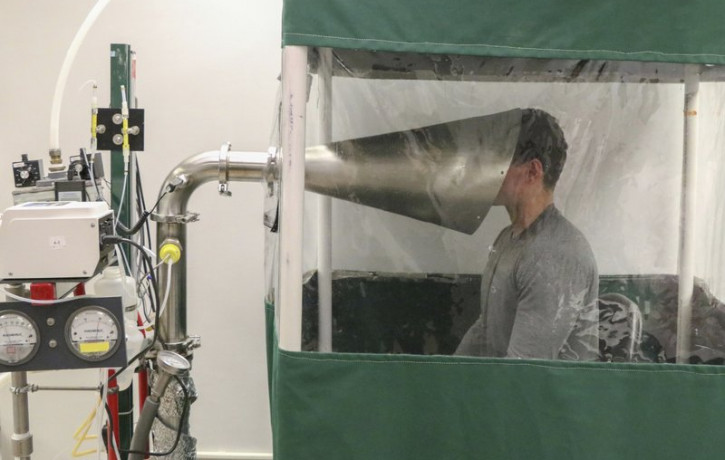 This February 2018 photo provided by the University of Maryland School of Public Health shows The Gesundheit II machine in Dr. Donald Milton's Public Health Aerobiology, Virology, and Exhaled