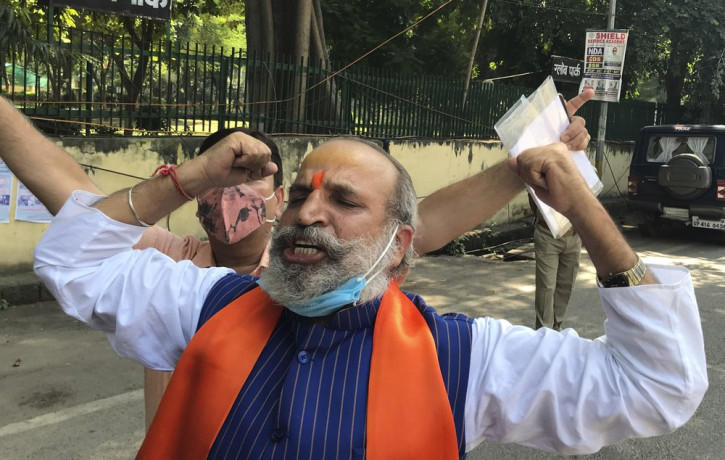 Jai Bhagwan Goyal, a leader of India's ruling Bharatiya Janata Party and an accused in the 1992 attack and demolition of a 16th century mosque, celebrates outside a court in Lucknow, India, W