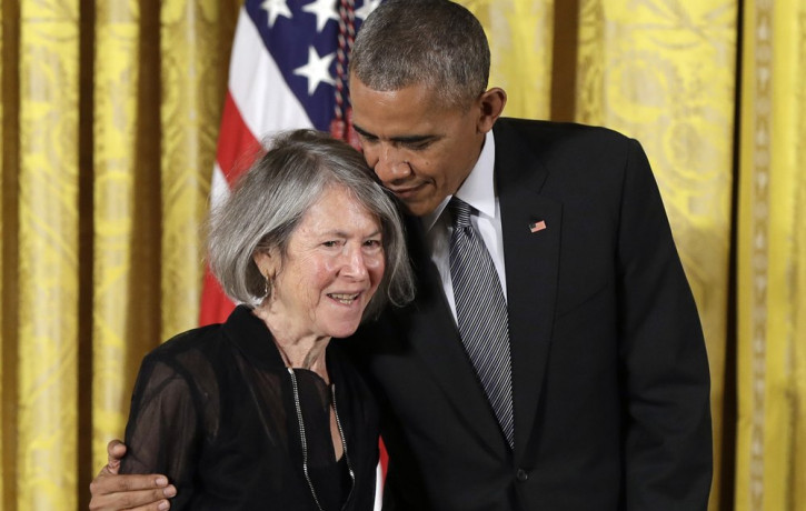 In this Thursday, Sept. 22, 2016 file photo, President Barack Obama embraces poet Louise Gluck before awarding her the 2015 National Humanities Medal during a ceremony in the East Room of the
