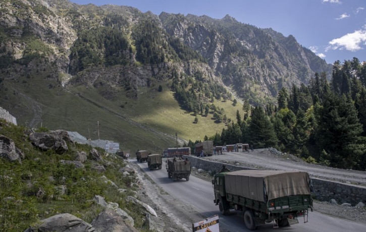 In this Sept. 9, 2020, file photo, an Indian army convoy moves on the Srinagar- Ladakh highway at Gagangeer, northeast of Srinagar, Indian-controlled Kashmir.