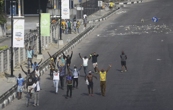 People demonstrate on the street to protest against police brutality in Lagos, Nigeria, Wednesday Oct. 21, 2020.