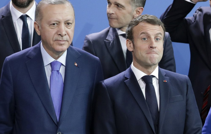In this Sunday, Jan. 20, 2020 file photo, Turkey's President Recep Tayyip Erdogan, left and French President Emmanuel Macron stand, during a group photo at a conference on Libya at the chance