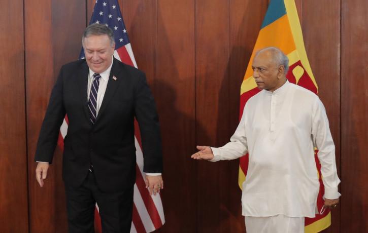 Sri Lankan Foreign Minister Dinesh Gunawardena gestures towards U.S. Secretary of State Mike Pompeo before their meeting in Colombo, Sri Lanka, Wednesday, Oct. 28, 2020.