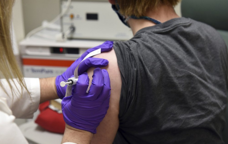 This May 4, 2020, file photo provided by the University of Maryland School of Medicine, shows the first patient enrolled in Pfizer's COVID-19 coronavirus vaccine clinical trial at the Univers