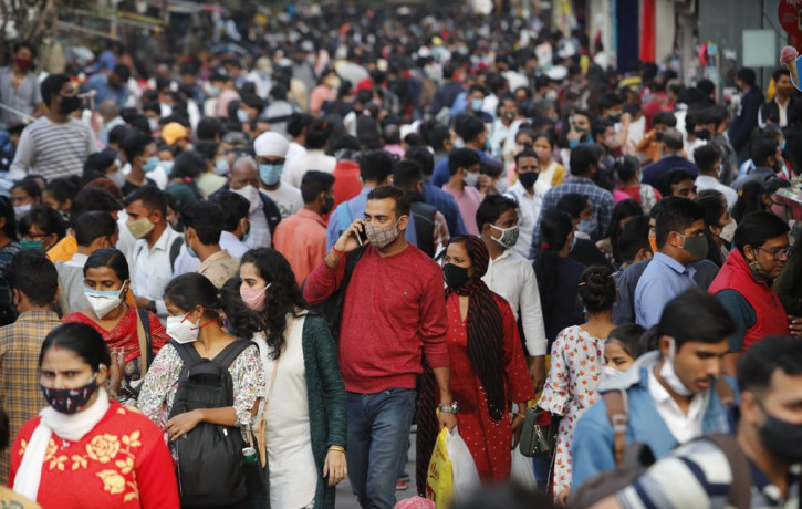 People throng a market to shop ahead of the Diwalli festival in New Delhi, India, Thursday, Nov. 12, 2020.