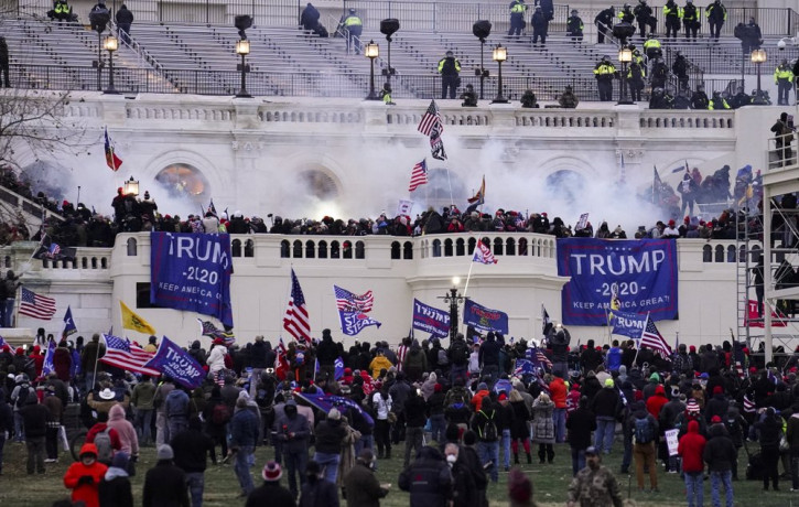 In this Wednesday, Jan. 6, 2021, file photo, violent protesters, loyal to President Donald Trump, storm the Capitol, in Washington.