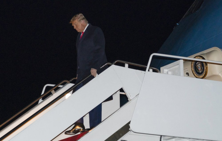 US President Donald Trump steps off Air Force One upon arrival, Tuesday, Jan. 12, 2021, at Andrews Air Force Base, Maryland.