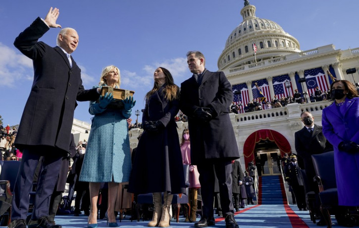 Joe Biden is sworn in as the 46th president of the United States by Chief Justice John Roberts as Jill Biden holds the Bible during the 59th Presidential Inauguration at the U.S. Capitol in W
