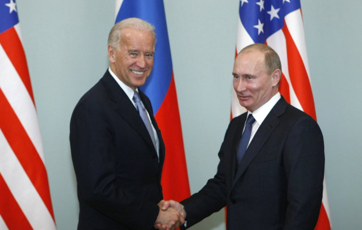 In this March 10, 2011, file photo, then-Vice President Joe Biden, left, shakes hands with Russian Prime Minister Vladimir Putin in Moscow, Russia.