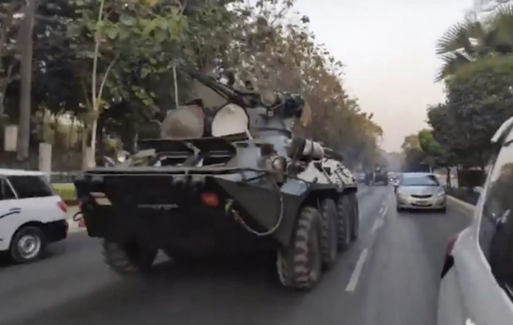In this image made from video by the Democratic Voice of Burma (DVB), two armored personnel carriers were seen traversing on a road in Yangon, Myanmar, Sunday, Feb. 14, 2021.