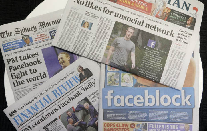 Front pages of Australian newspapers are displayed featuring stories about Facebook in Sydney, Friday, Feb. 19, 2021.