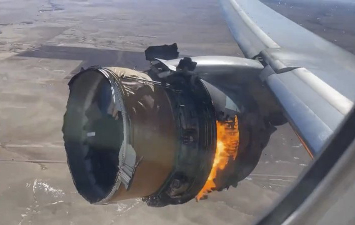 In this image taken from video, the engine of United Airlines Flight 328 is on fire after after experiencing "a right-engine failure" shortly after takeoff from Denver International Airport, 