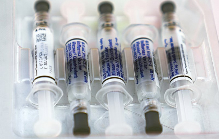 This Saturday, Oct. 17, 2020 file photo shows influenza vaccine syringes at the L.A. Care Health Plan and Blue Shield of California Promise Health Plan's Community Resource Center's Free Driv