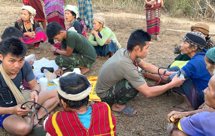 In this photo released by the Free Burma Rangers, members of the humanitarian group Free Burma Rangers carry out medical checkups on villagers in the northern Karen State, Myanmar Feb. 25, 20