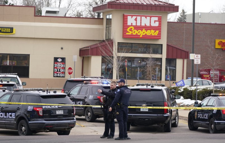 Police work on the scene outside of a King Soopers grocery store where a shooting took place Monday, March 22, 2021, in Boulder, Colorado.