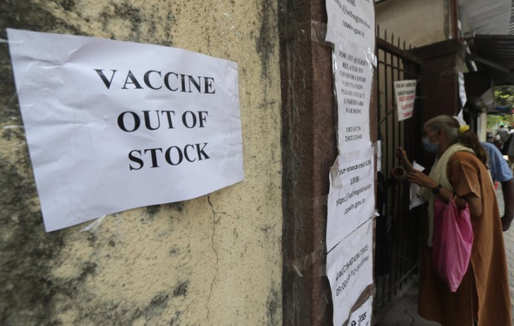 A note informing about the COVID-19 vaccine is seen pasted on a wall of a vaccination centre in Mumbai, India, Thursday, April 8, 2021.