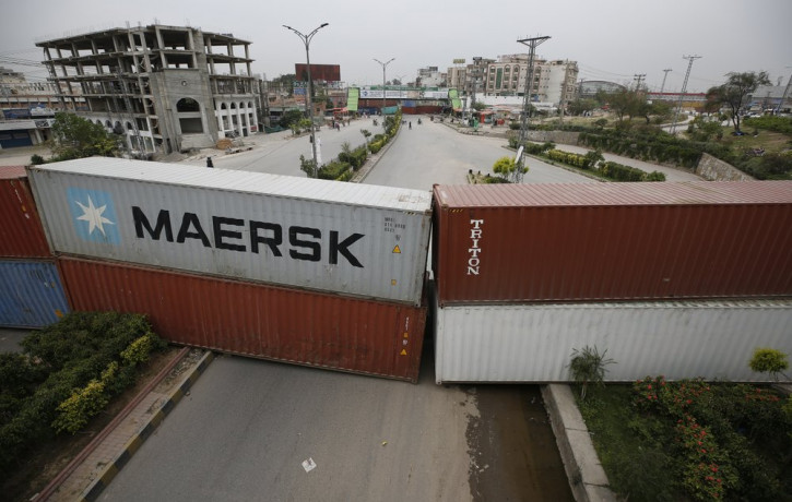 Authorities place shipping containers to block a road leading to the capital as a security measure on the possible anti-France protest march by a banned radical Islamists Tehreek-e-Labaik Pak
