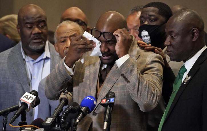 George Floyd's brother Philonise Floyd wipes his eyes during a news conference, Tuesday, April 20, 2021, in Minneapolis, after the verdict was read in the trial of former Minneapolis Police o