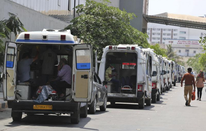 Ambulances carrying COVID-19 patients line up waiting for their turn to be attended at a dedicated COVID-19 government hospital in Ahmedabad, India, Thursday, April 22, 2021.