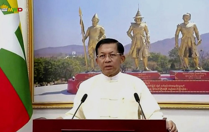 In this file image from video broadcast April 18, 2021, over the Myawaddy TV channel, Senior Gen. Min Aung Hlaing delivers his address to the public during Myanmar New Year.