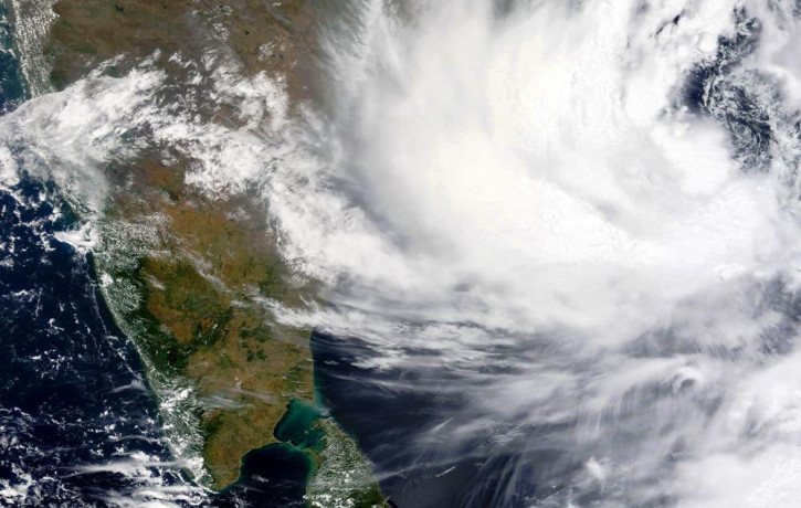 This Monday, May, 24, 2021, satellite image provided by NASA shows Cyclone Yaas approaching India's eastern coast.