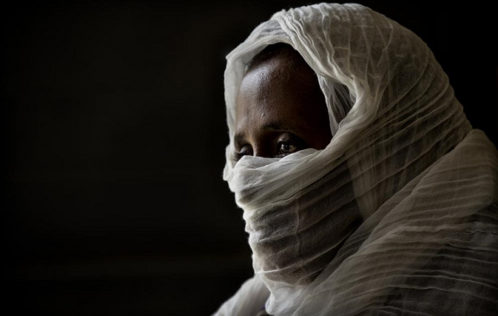 A 40-year-old woman who was says she was held captive and repeatedly raped by 15 Eritrean soldiers over a period of a week in a remote village near the Eritrea border.