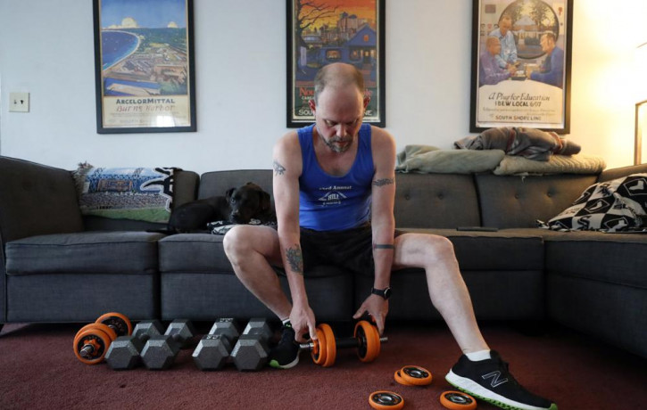 Christian Hainds prepares for a workout session at his home in Hammond, Indiana, Monday, June 7, 2021.