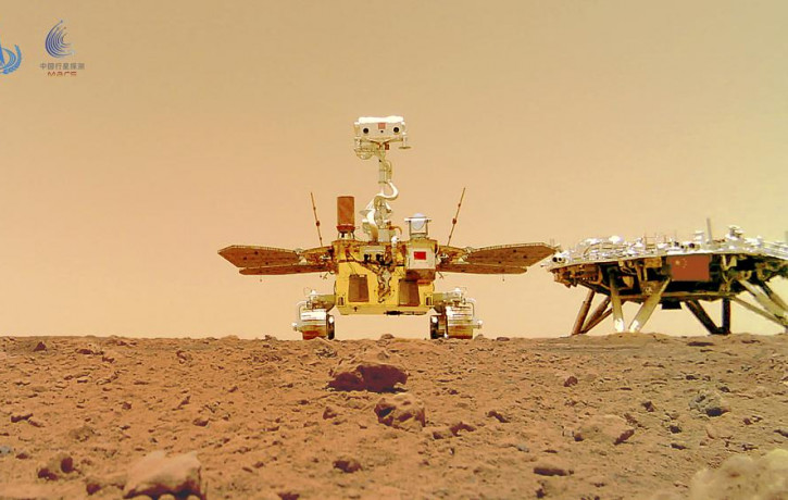 In this image released by the China National Space Administration (CNSA) on Friday, June 11, 2021, the Chinese Mars rover Zhurong is seen near its landing platform taken by a remote camera th