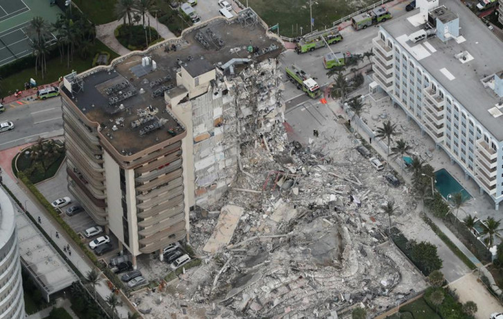 This aerial photo shows part of the 12-story oceanfront Champlain Towers South Condo that collapsed early Thursday, June 24, 2021 in Surfside, Florida.