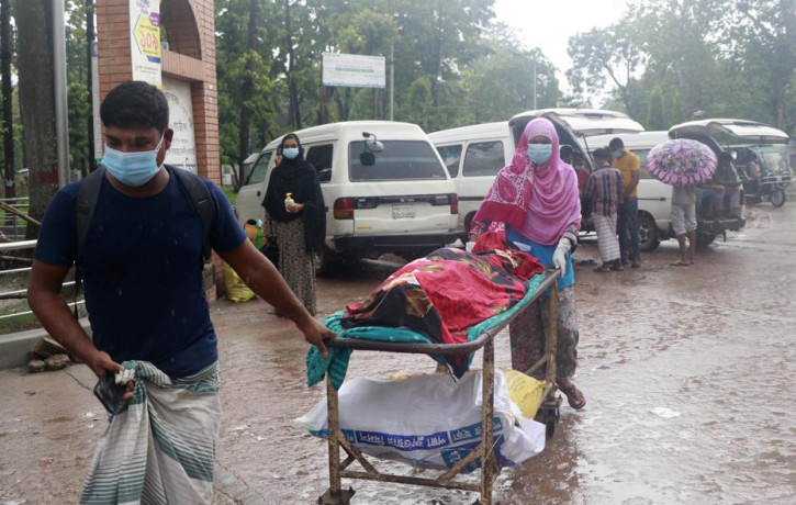 People leave for home with body of a relative at the Medical College Hospital in Rajshahi, 254 kilometers (158 miles) north of the capital, Dhaka, Bangladesh, June 15, 2021.