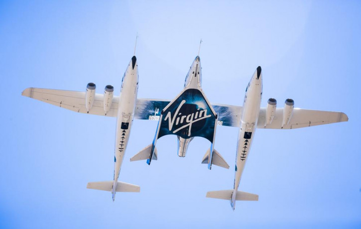 This Sept. 8, 2016 photo made available by Virgin Galactic shows the company's Spaceship Unity and Mothership Eve.