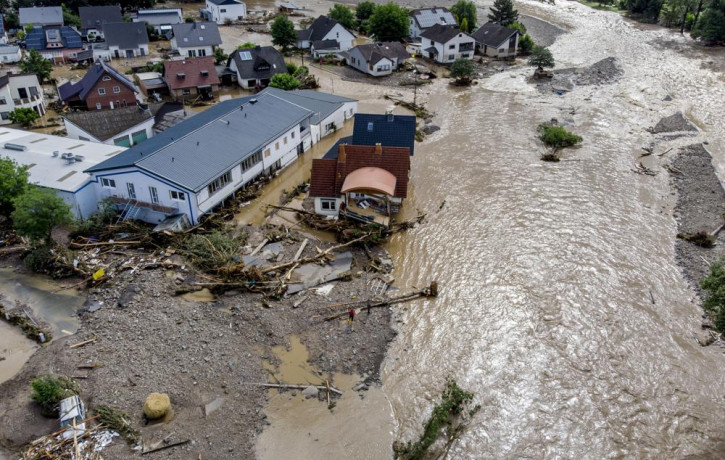 Damaged houses are seen at the Ahr river in Insul, western Germany, Thursday, July 15, 2021.