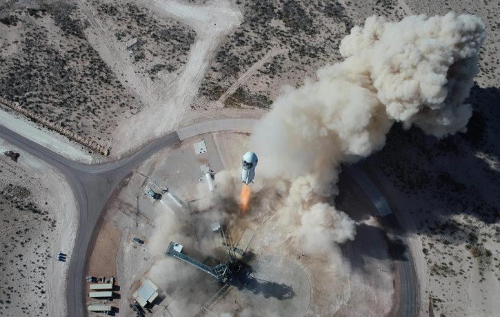 In this Jan. 14, 2021 photo made available by Blue Origin, the New Shepard NS-14 rocket lifts off from Launch Site One in West Texas.