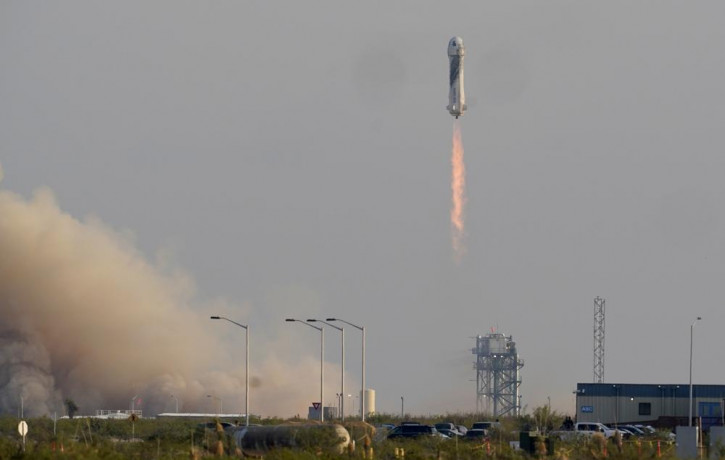Blue Origin's New Shepard rocket launches carrying passengers Jeff Bezos, founder of Amazon and space tourism company Blue Origin, brother Mark Bezos, Oliver Daemen and Wally Funk, from its s