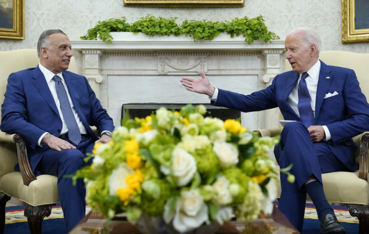 US President Joe Biden, right, speaks as Iraqi Prime Minister Mustafa al-Kadhimi, left, listens during their meeting in the Oval Office of the White House in Washington, Monday, July 26, 2021