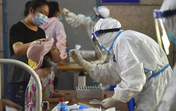 A nurse takes swab samples in the new rounds of Covid-19 testing in Nanjing in eastern China's Jiangsu province Monday, Aug. 2, 2021.