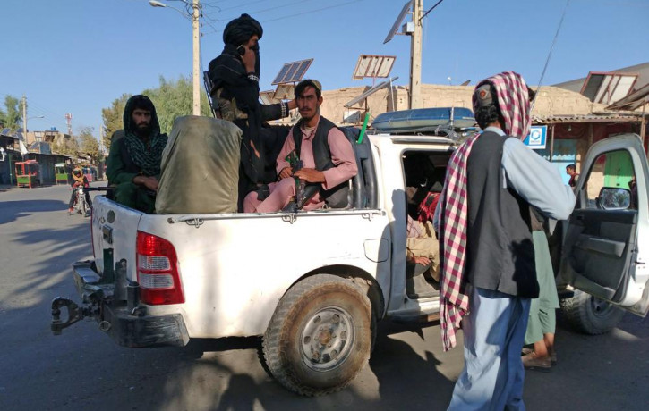 Taliban fighters patrol inside the city of Farah, capital of Farah province southwest of Kabul, Afghanistan, Wednesday, Aug. 11, 2021.