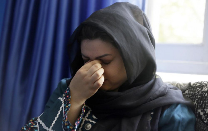 Zarmina Kakar a women's rights activist cry during an interview with The Associated Press in Kabul, Afghanistan, Friday, Aug. 13, 2021.