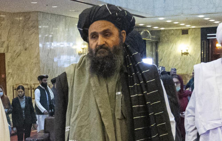 In this March 18, 2021, file photo, Taliban co-founder Mullah Abdul Ghani Baradar, arrives with other members of the Taliban delegation for an international peace conference in Moscow, Russia