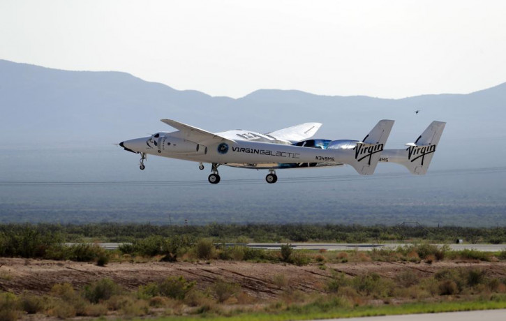 In this Sunday, July 11, 2021 file photo, the craft carrying Virgin Galactic founder Richard Branson and other crew members takes off from Spaceport America near Truth or Consequences, New Me