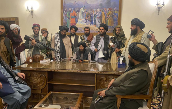In this Aug. 15, 2021 file photo, Taliban fighters take control of Afghan presidential palace in Kabul, Afghanistan, after President Ashraf Ghani fled the country.